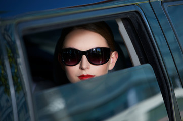 Portrait of beautiful business woman inside the limo car - obrazy, fototapety, plakaty
