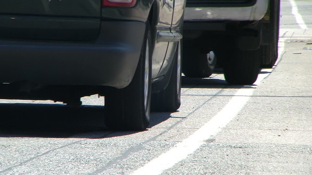 Moving cars: A careless car crossing line of cars