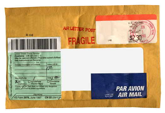 single yellow mail package (envelope, CN22 form),recycled paper,