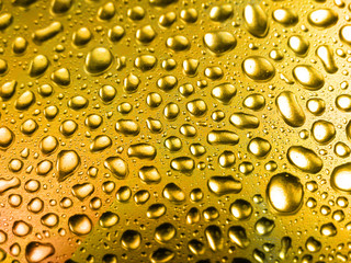 Golden close-up water drops background