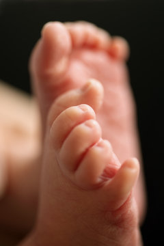 Tiny feet of a newborn baby
