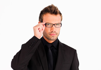 Businessman with glasses looking at the camera