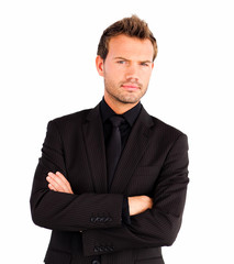Young businessman with folded arms