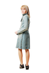 girl in a blue overcoat isolated on white background