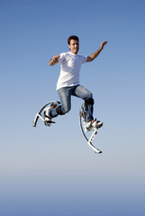 Obraz premium a young man jumping high in the sky
