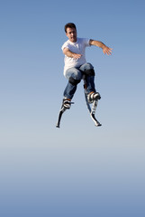 Fototapeta na wymiar a young man jumping high in the sky
