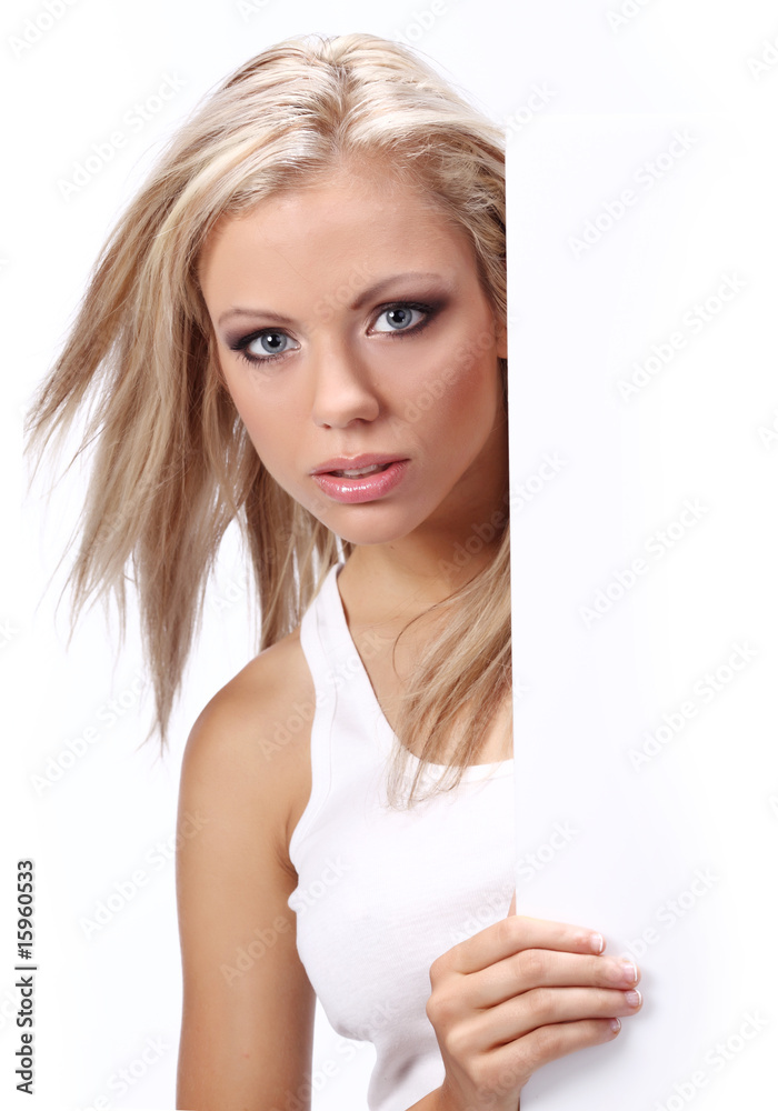 Wall mural sexy girl holding a billboard add isolated over a white backgrou