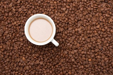 Cup with coffee, costing on coffee grain