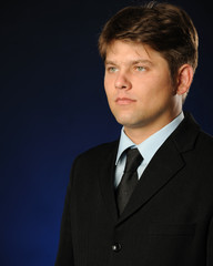 The businessman talking by a mobile phone