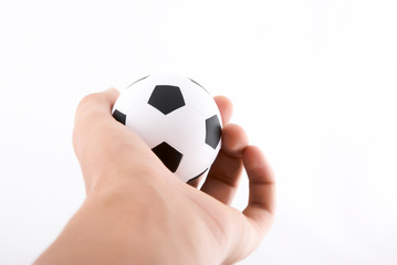 Hand holding football ball