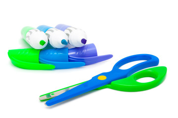 Three color office markers and scissors isolated