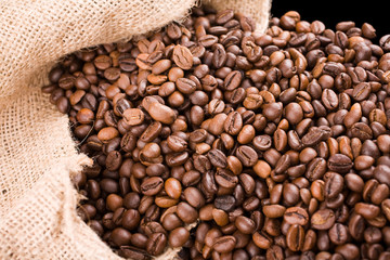 coffee poured out of a sack to the left side