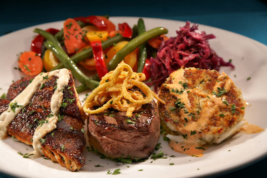 Blackened Fish, Filet Mignon Steak, Crab Cakes And Veggies