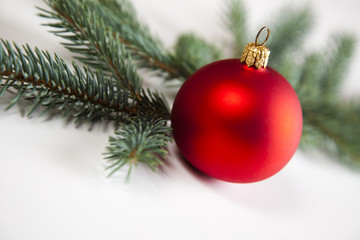 Fototapeta na wymiar Red bauble as a symbol of Christmas