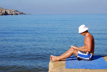 Man reading on holiday