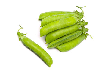 Pods of fresh green peas on a white background
