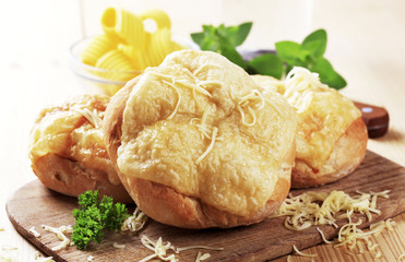 Rolls with melted cheese on top