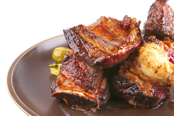 roast ribs on old style ceramic dish close up