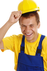 Happy worker taking off his hard hat and smile