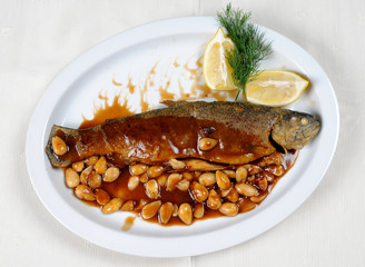 Roasted gilt fish with beans and (garlic, parsley) sauce.