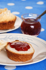 closeup tea biscuits with jam