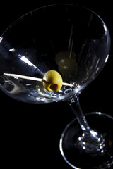 Olive on a martini glass