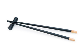 Black chopsticks isolated on the white