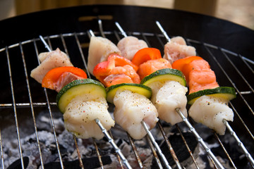 fish spear grilling on barbecue