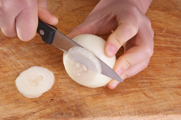 prepare onion to use, two hands and a knife