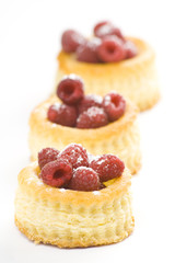 raspberry pastry cream and decorated with lemon parsley