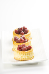 raspberry pastry cream and decorated with lemon parsley