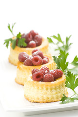 raspberry pastry cream and decorated with lemon parsley