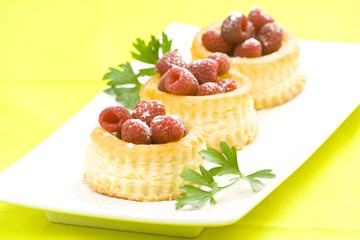 raspberry pastry cream and decorated with lemon parsley
