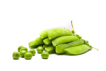 Pods of fresh green peas on a white background