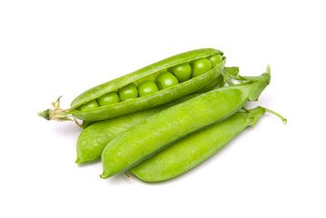 Pods of fresh green peas on a white background