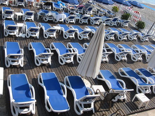 Fototapeta premium Sun beds on the beach in Nice, France