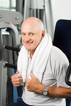 Older man exercising at the gym