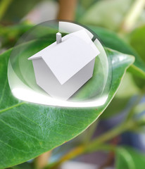 Maison blanche lumineuse dans goutte d'eau