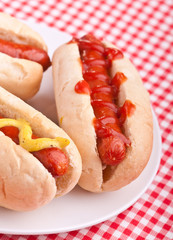 group of hot dogs on a plate