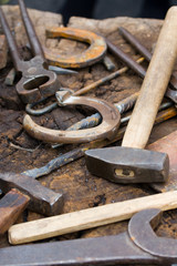 Rusty blacksmith tools and horseshoes