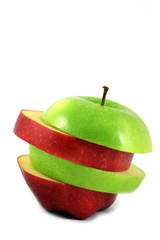 Sliced red and green apple on white background
