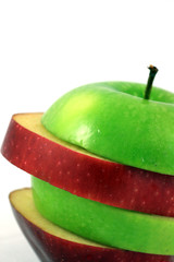 Sliced red and green apple on white background
