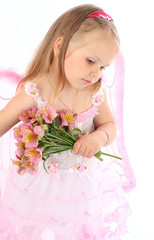 Portrait of the small princess in a pink dress