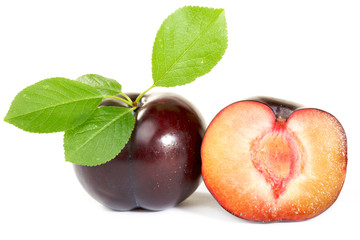 Two Plums with leaves isolated on white background