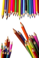 Colored pencils over white background