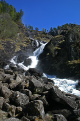 Waterfall falling with high speed from a mountain
