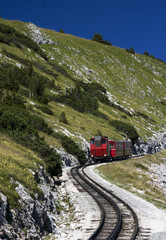 Fototapeta na wymiar Red train in the mountains