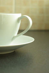 white coffee cup and saucer