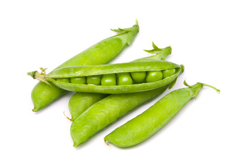 Pods of fresh green peas on a white background