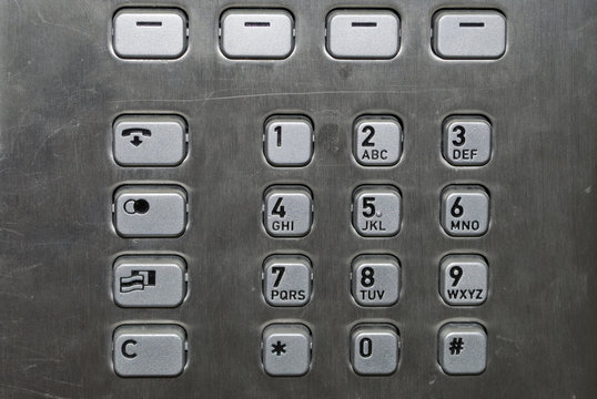 Metallic number pad on a public phone
